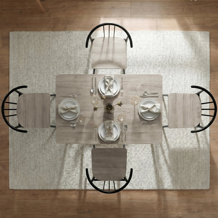 [Grey] Torvi 4 seater dining set seen from above with place settings on grey oak table and four chairs