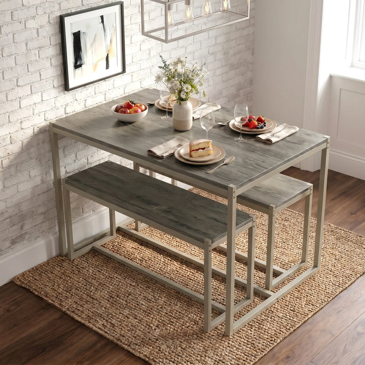 [Grey] Orvak Grey 4 Seater Dining Table With Bench Set displayed in a bright dining space with geometric pendant light, fruit bowl, and strawberry dessert place setting