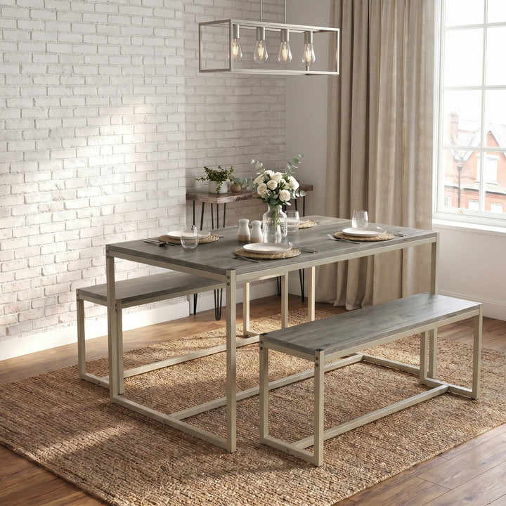 [Grey] Orvak Grey 4 Seater Dining Table With Bench Set in a light-filled room with industrial cage pendant light, white rose bouquet, and woven placemats on both sides