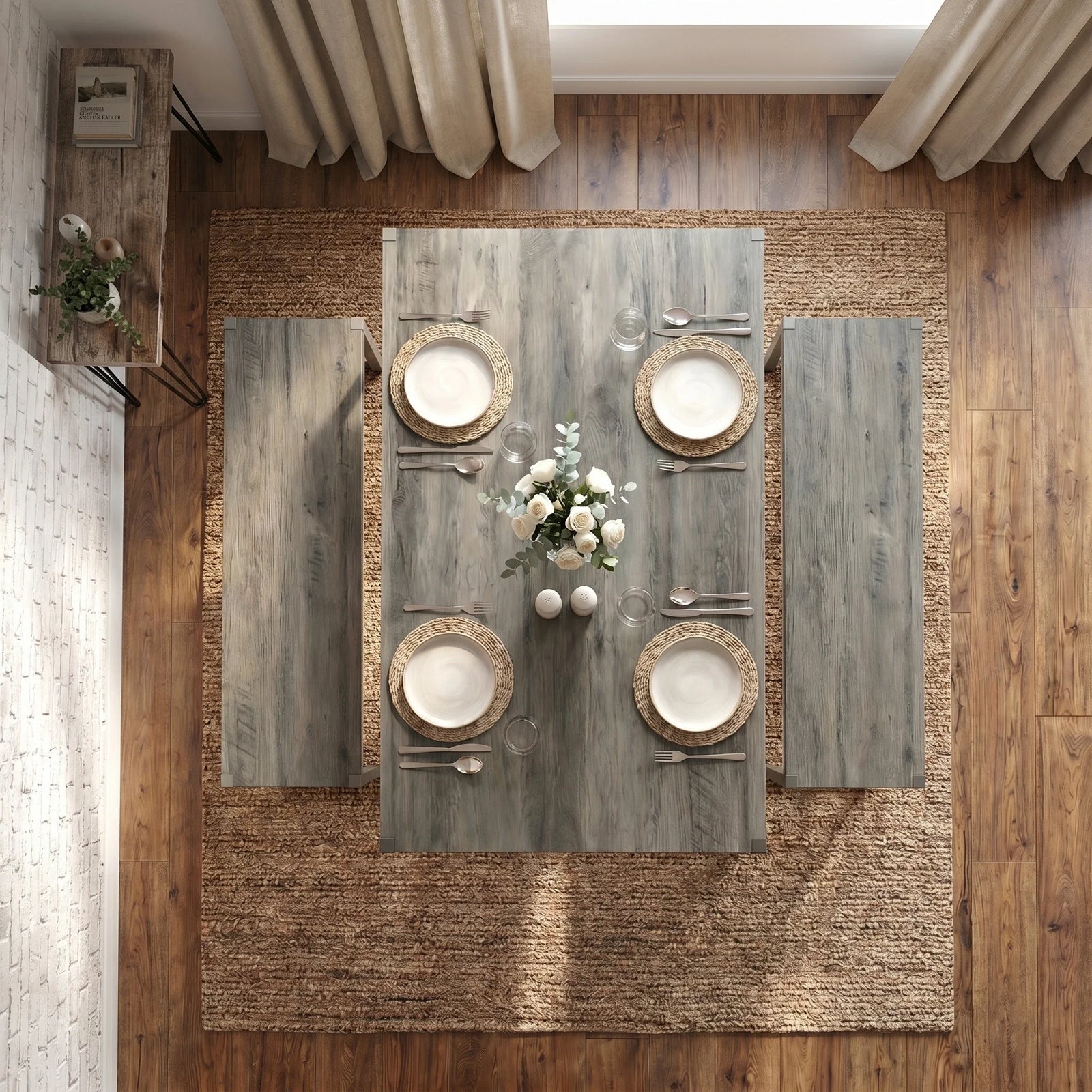 [Grey] Orvak Grey 4 Seater Dining Table With Bench Set seen from directly above showing four woven placemats, white rose centrepiece, and full cutlery layout on jute rug