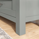 [Grey] Oskara TV unit close-up of solid square grey painted leg construction and shaker drawer front detail on light oak wood flooring