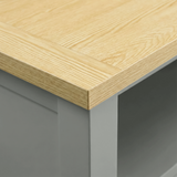 [Grey] Oskara TV unit close-up of natural oak top surface showing wood grain texture and corner edge against grey painted frame