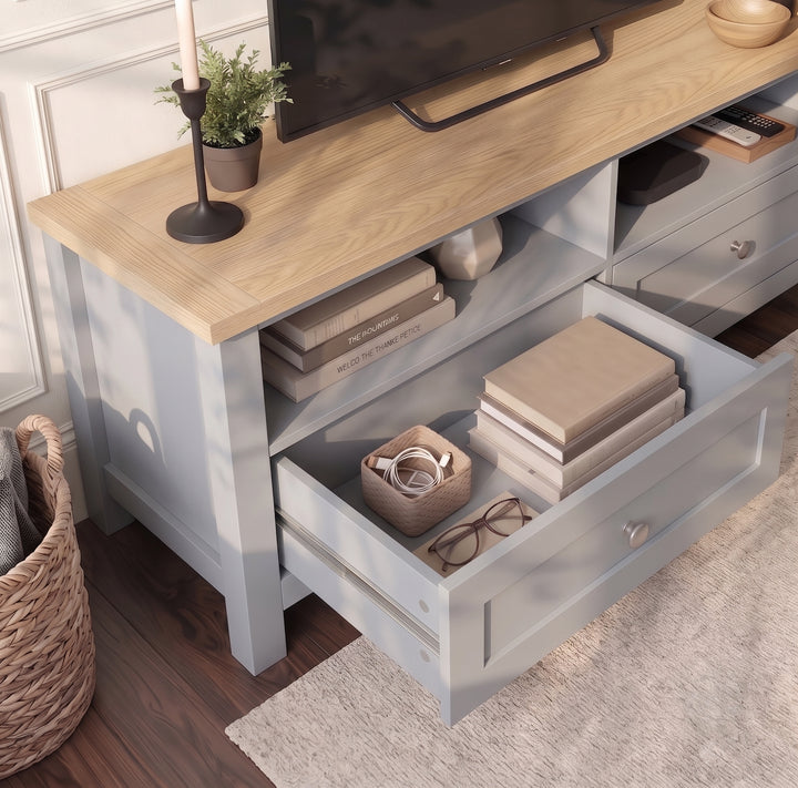 [Grey] Elevated close-up of the open storage drawer and open shelf on the Oskara Grey Painted TV Unit.