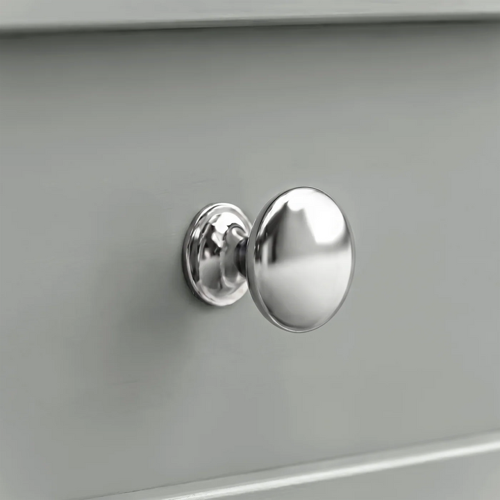 [Grey] Close-up shot of the polished chrome round knob handle on the Oskara Grey Painted TV Unit drawer.