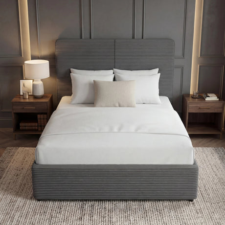 Single grey ottoman bed frame with upholstered headboard and footboard placed in the middle of a modern room