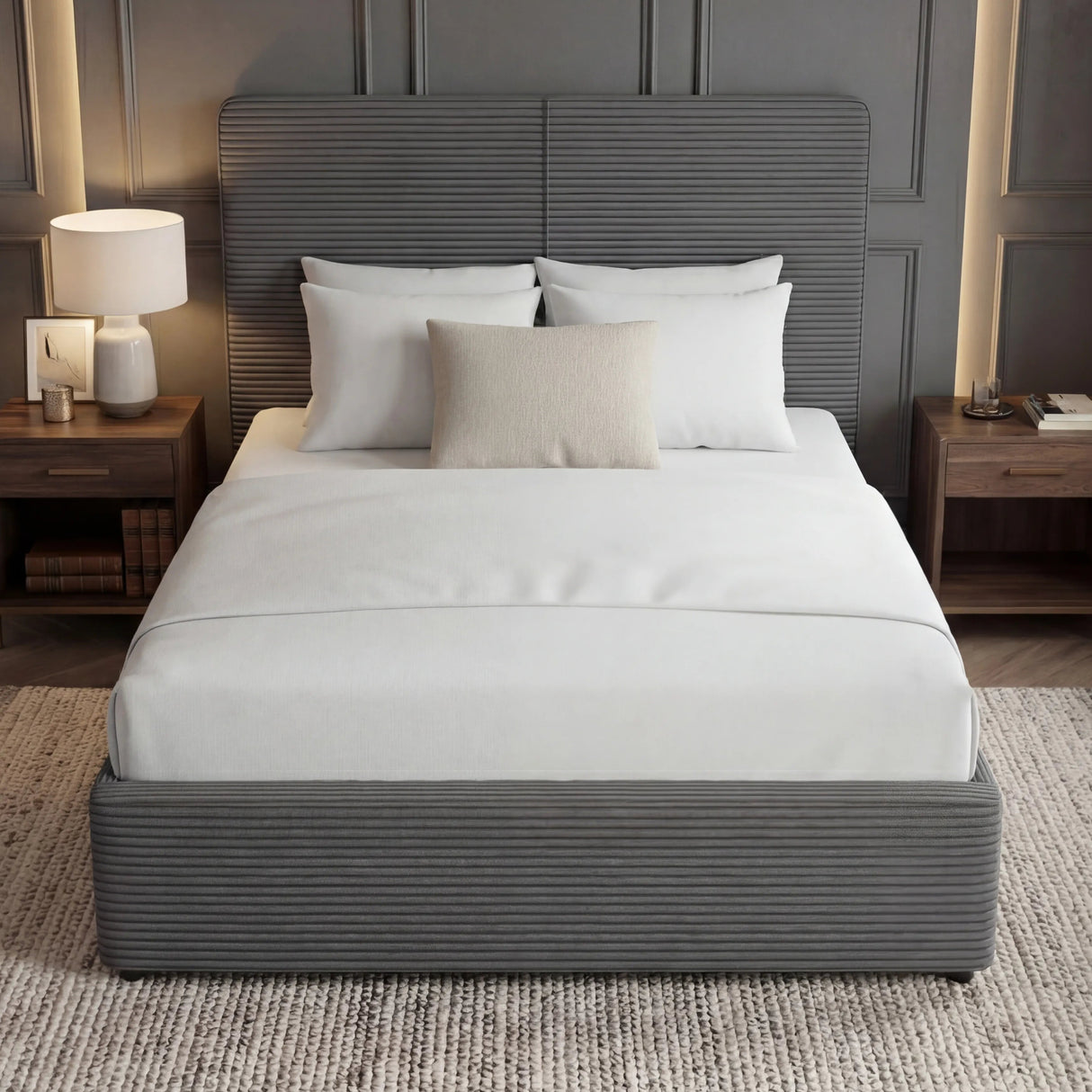 Grey ottoman double bed with upholstered headboard and footboard placed in the middle of a modern room