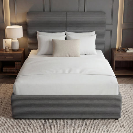 Grey ottoman double bed with upholstered headboard and footboard placed in the middle of a modern room