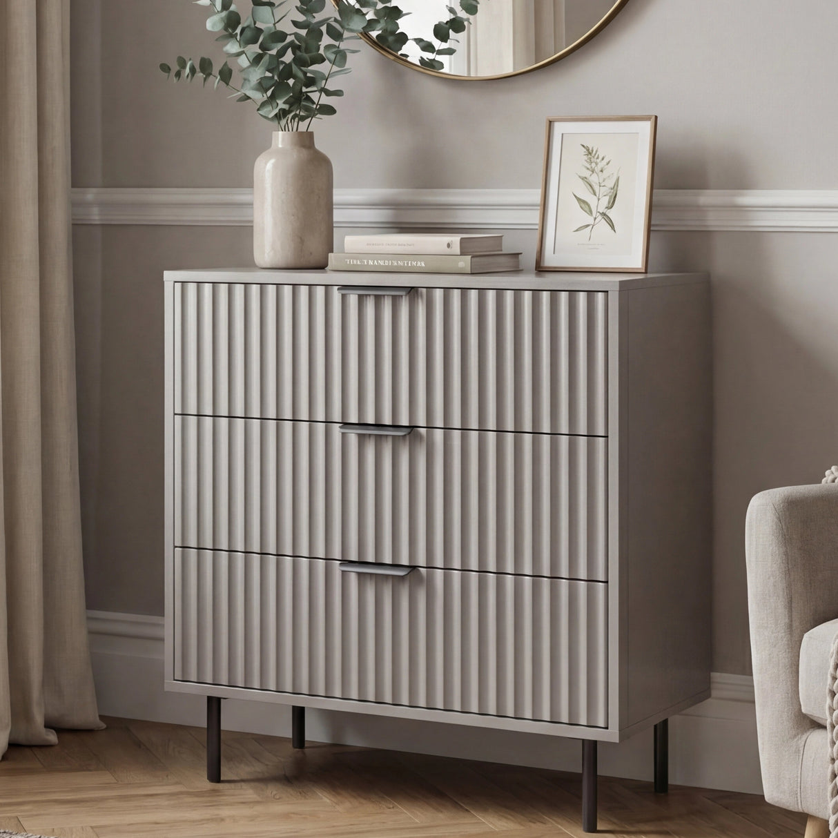 Front perspective of grey bedroom three chest of drawers with structured flutrina pattern detailing
