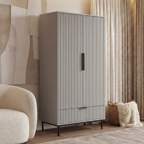 Grey double door wardrobe with panelled front, a drawer and minimalist black metal handle design and legs