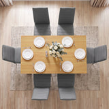 [Grey & Pine] Overhead dining set view showing six chairs around laid tabletop with plates and flower vase.