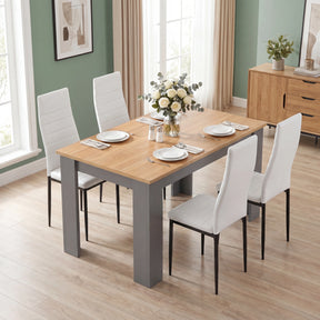 [4 Seater | White] Front view of a Grey & Pine 4-6 seater dining table with four white faux-leather chairs.