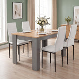 [4 Seater | White] Angled high-angle view of a Grey & Pine 4-6 seater dining table with four white faux-leather chairs.