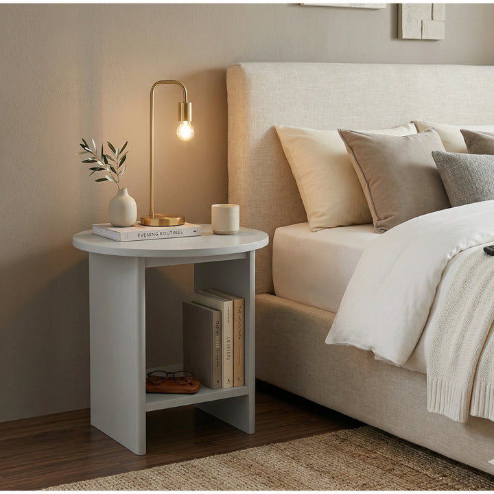 [Grey] Small Round Side Table with Shelf Living Room used as bedside table beside upholstered bed with brass arc lamp on top and books on lower shelf