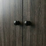 [Grey Wooden] Selby wardrobe close-up of two matte black round door knobs on grey wood-effect door panels