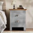 [Grey] shaker 2 drawer bedside table in grey with oak effect top silver cup handles beside cream bed