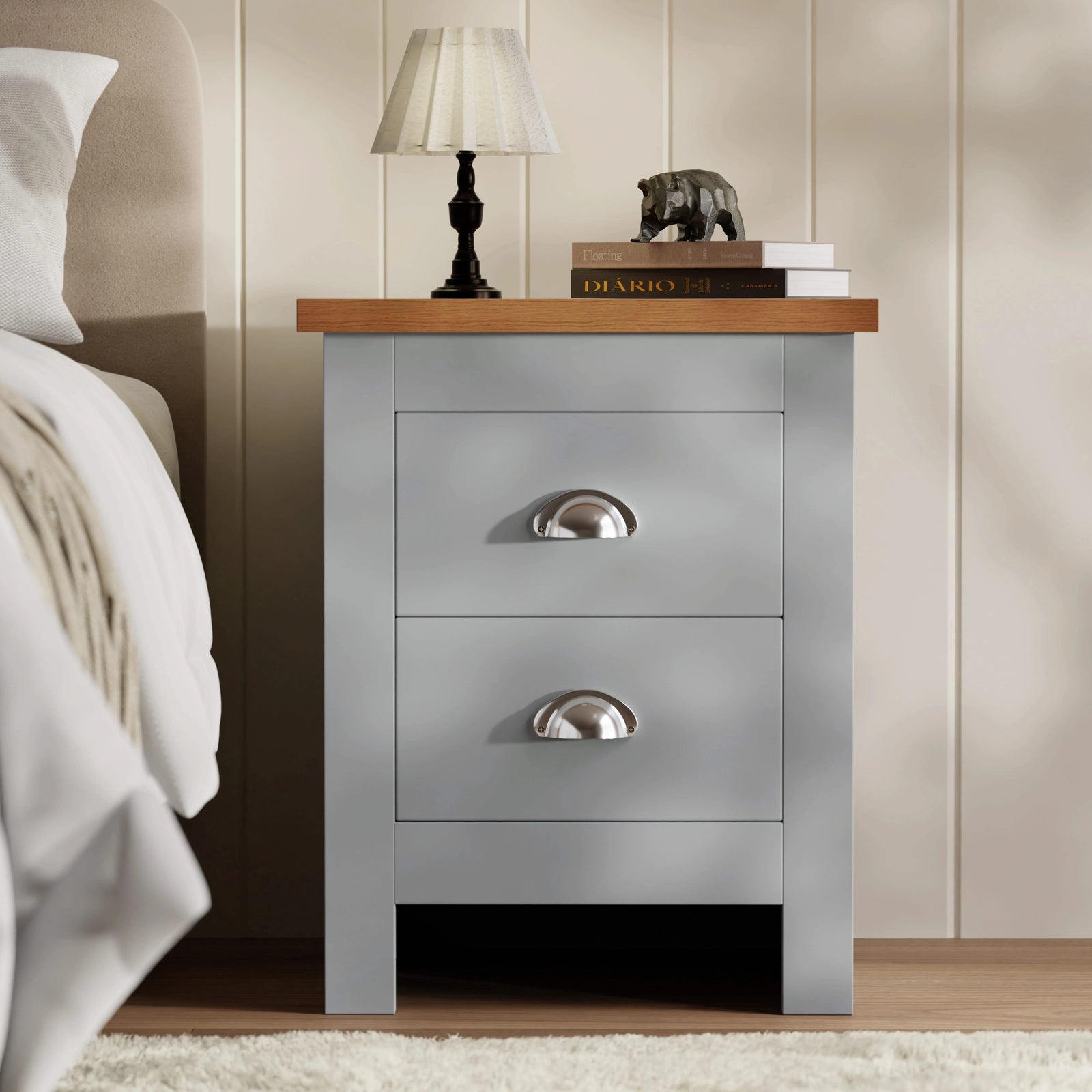[Grey] shaker 2 drawer bedside table in grey with oak effect top silver cup handles beside cream bed