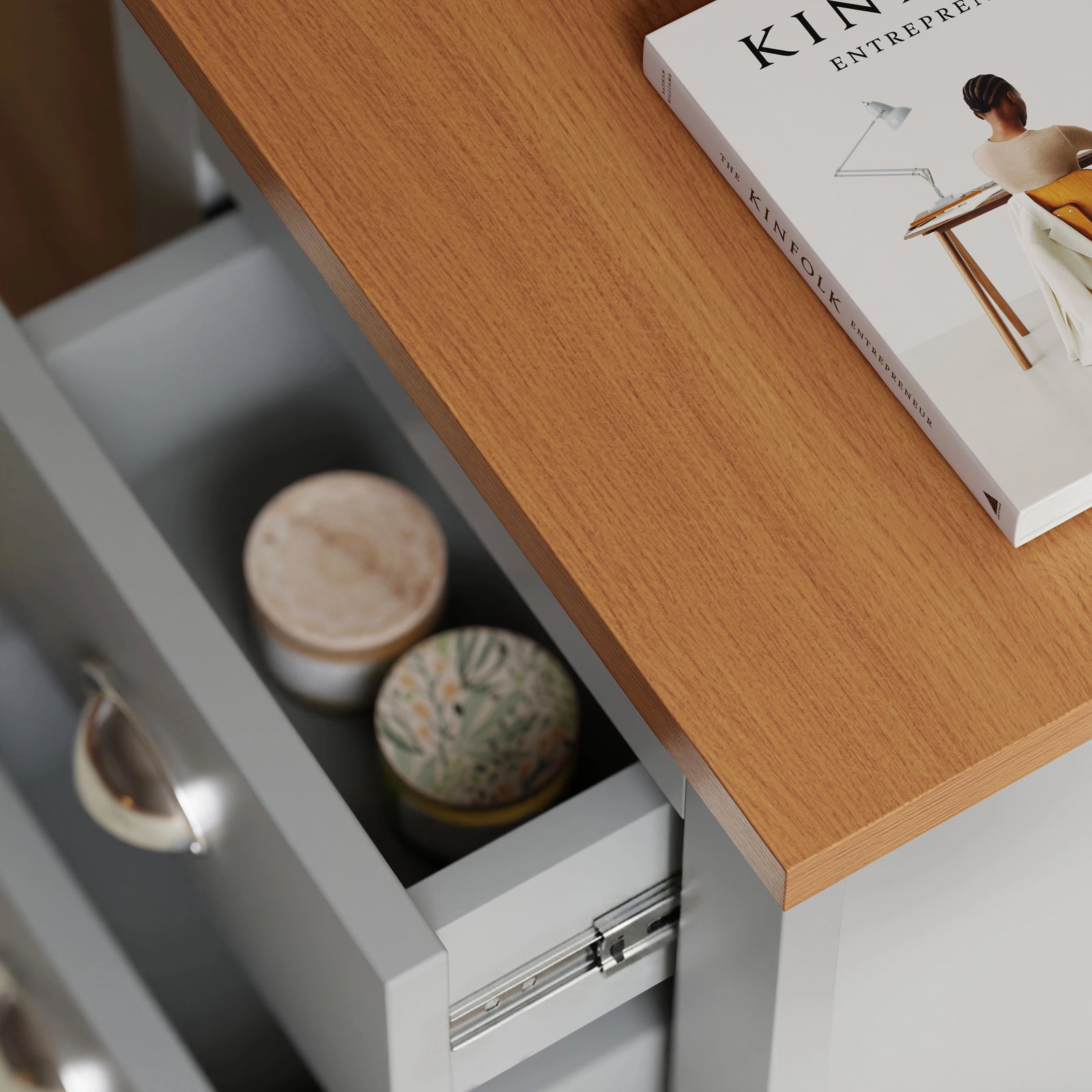 [Grey] close up of oak effect top and open drawer with two ceramic candles inside grey shaker bedside