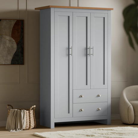 Buy Shaker Triple Wardrobe With Shelves And Drawers in grey finish featuring 3 shaker-style doors, 2 drawers, and a wooden top for elegant bedroom storage.