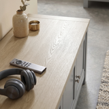 [Grey] Shaker TV unit 180cm oak effect top close-up with remote control and decorative items