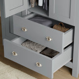 close-up of grey shaker wardrobe drawers with brushed metal handles, showing deep storage for clothes and accessories