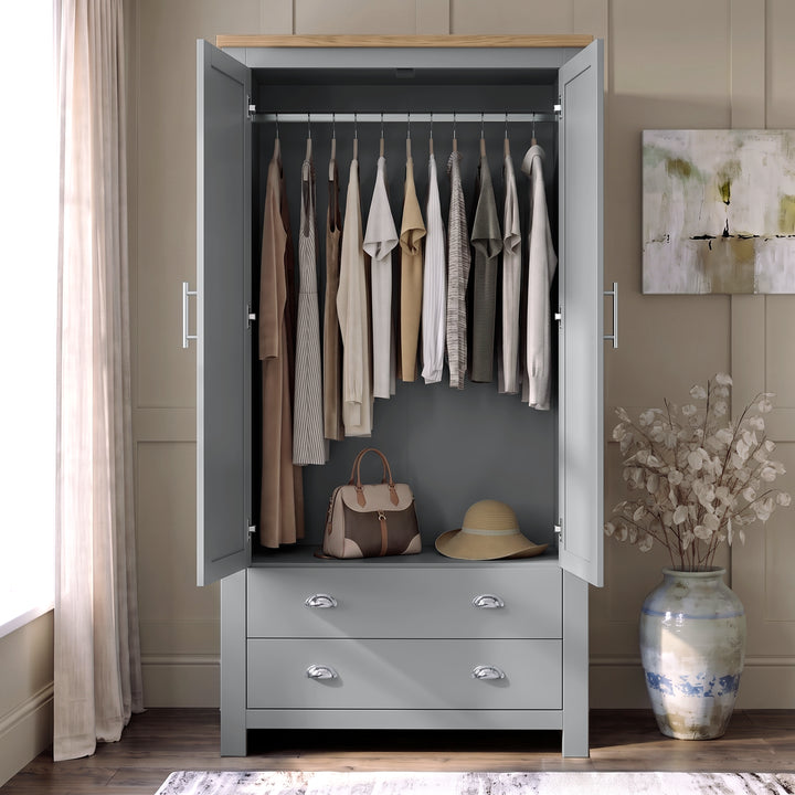 [Grey] Wardrobe interior view with both doors open, hanging clothes, top shelf, lower drawers, handbag, and hat