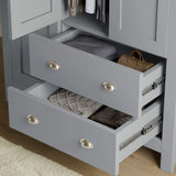 [Grey] close-up of grey shaker wardrobe drawers with brushed metal handles, showing deep storage for clothes and accessories