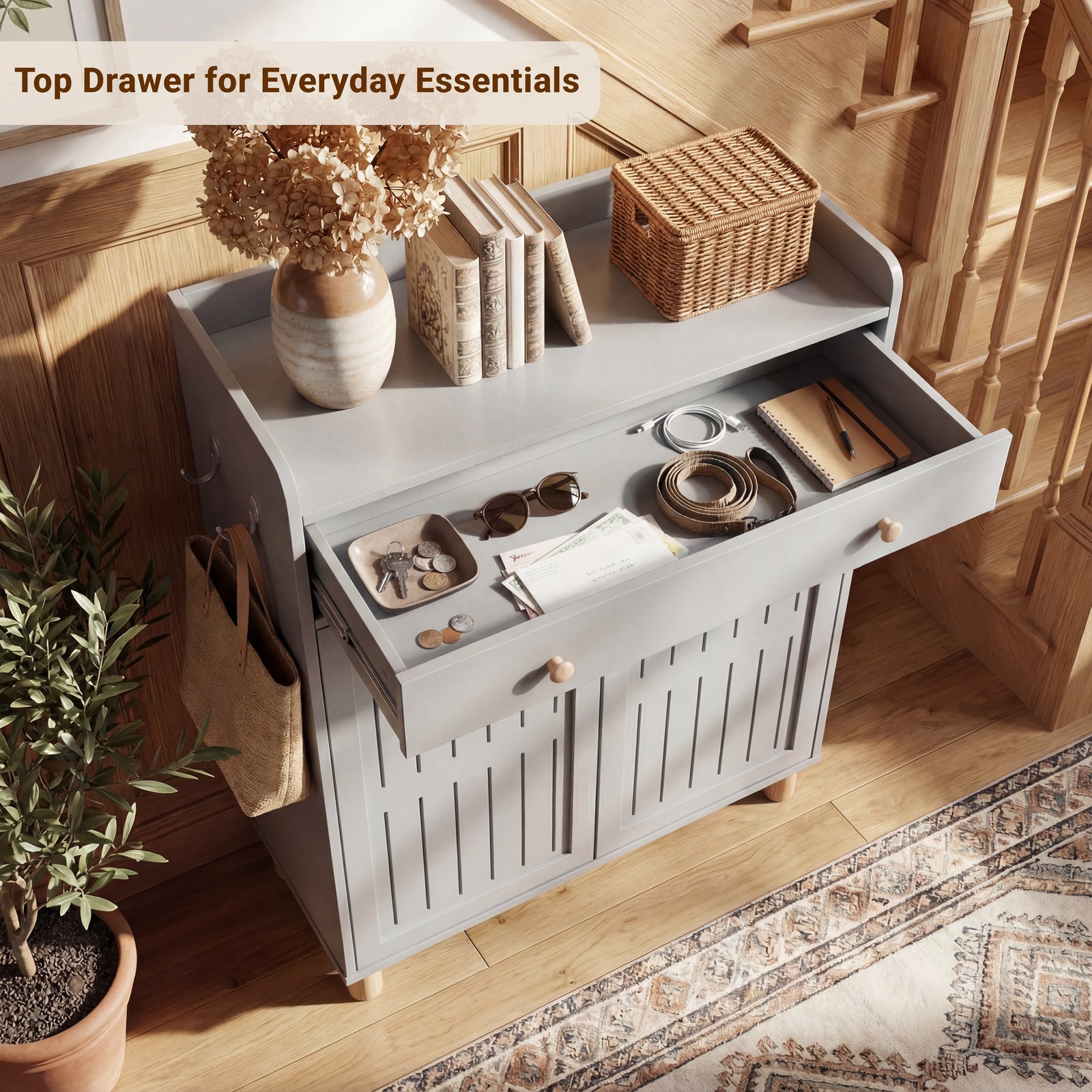 [Grey] Overhead view of a shallow drawer used for small personal items, of a multi-shelf footwear storage unit