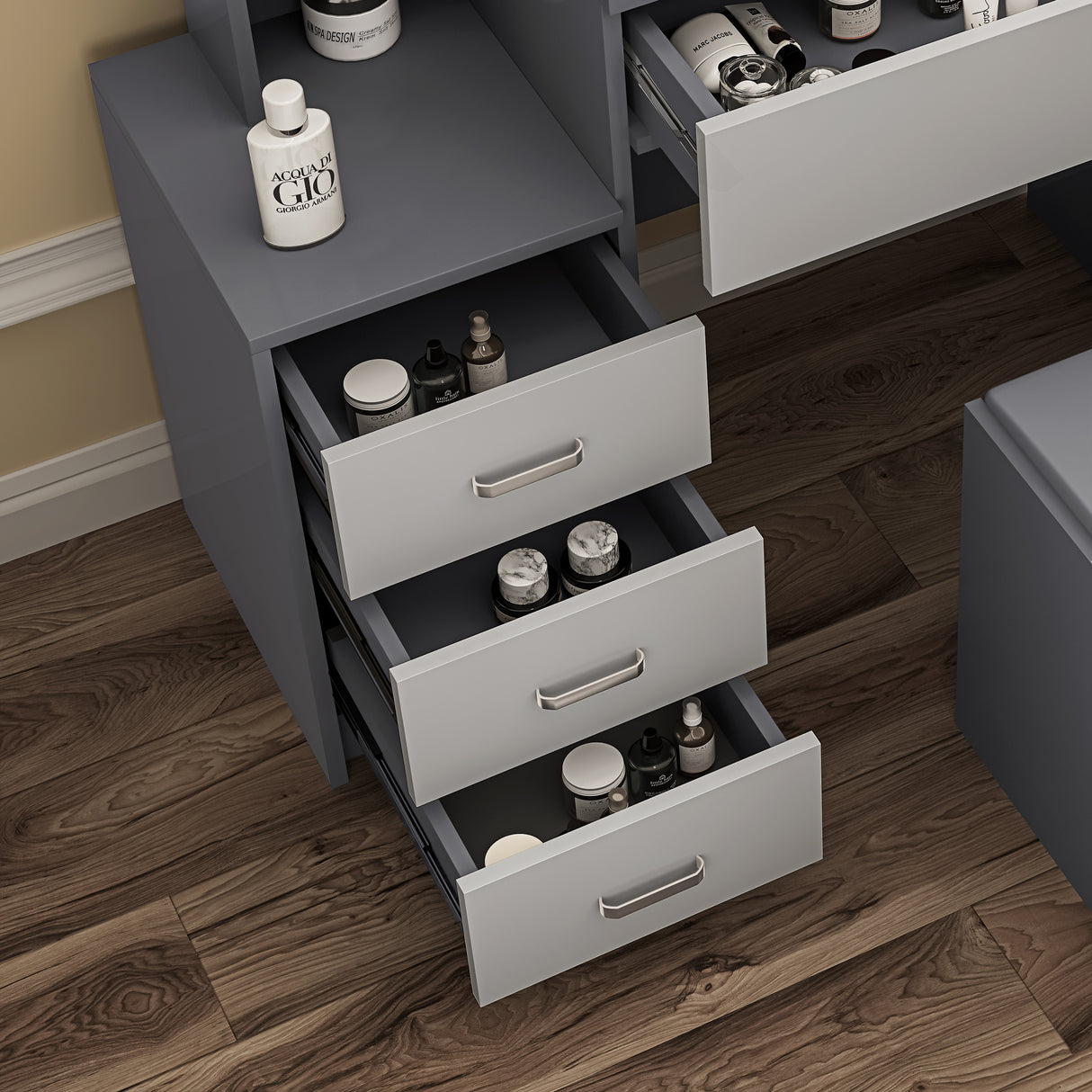 Grey and silver-grey dressing table with mirror and matching stool for a chic vanity setup.