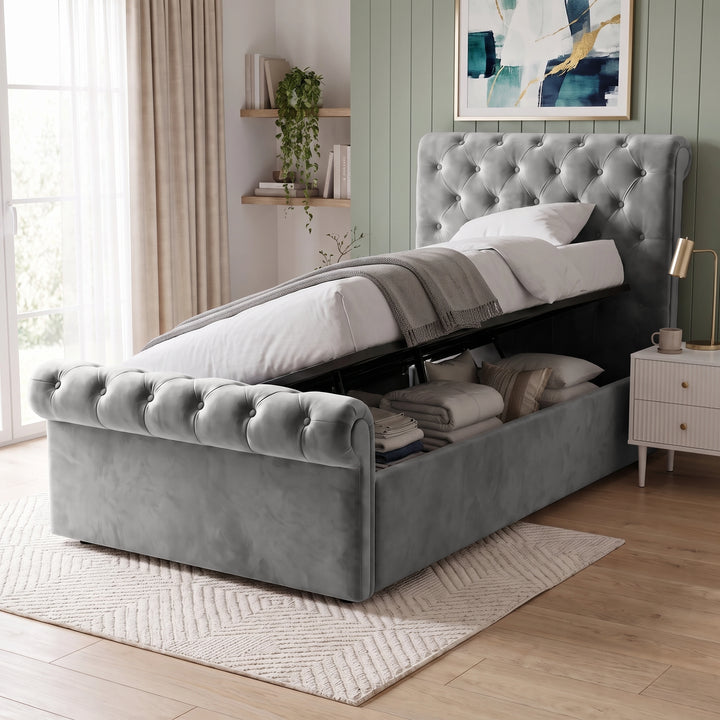 [Single | Grey] Hydraulic lift mechanism raised to reveal under-bed storage space on the Chesterfield Single Ottoman Storage Bed Frame.