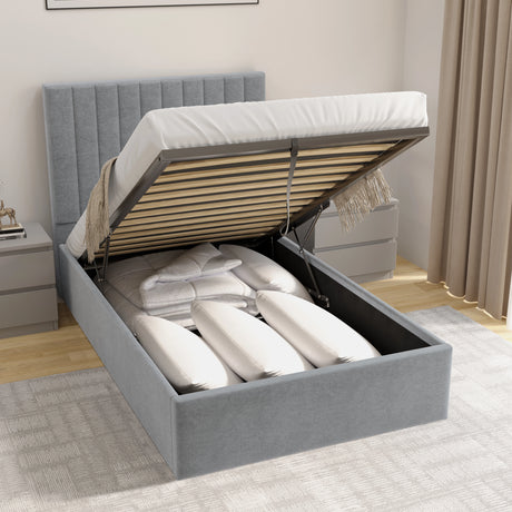 Grey upholstered bed with open storage compartment in a bedroom setting