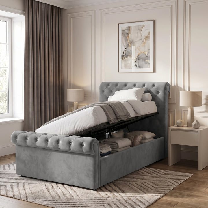 [Small Double | Grey] Hydraulic lift mechanism raised to reveal under-bed storage space on the Chesterfield Small Double Ottoman Storage Bed.