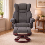 [Grey - Linen] recliner chair with a matching footstool and dark wood swivel base, shown in a styled living room setting with a window, side table, lamp, and rug.