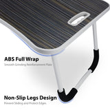 Grey laptop table with ABS full wrap and non-slip legs design for stability.