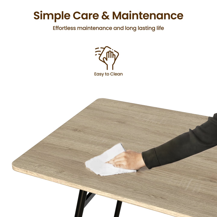 [Grey] Torvi care graphic showing a hand wiping the wood-grain tabletop with a cloth, plus an easy-clean icon.