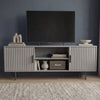 Modern grey TV entertainment unit with vertical fluted doors and silver legs for a contemporary living room aesthetic.