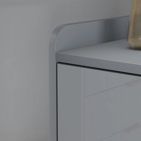 Gray tv unit with a geometric vase on a neutral background