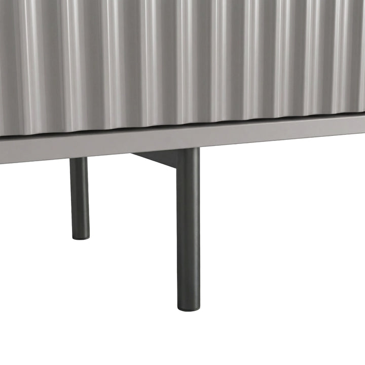 [Grey]  TV unit with slim metal legs and fluted doors, showing an elevated modern design for a living room.