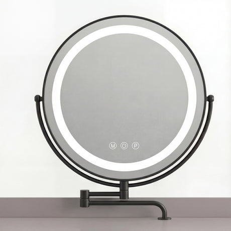 Round mirror on a grey vanity table, featuring soft, adjustable lighting to enhance your reflection while applying makeup