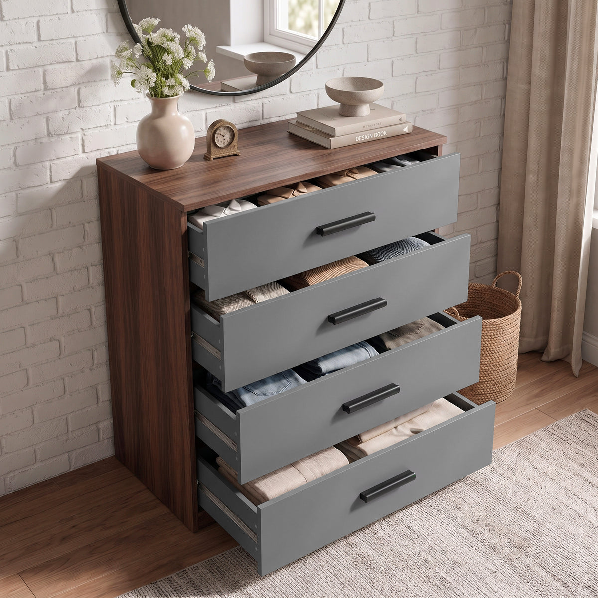 [Walnut] Angled top view of a grey and walnut chest of drawers showing all 4 drawers pulled open with stored clothing items