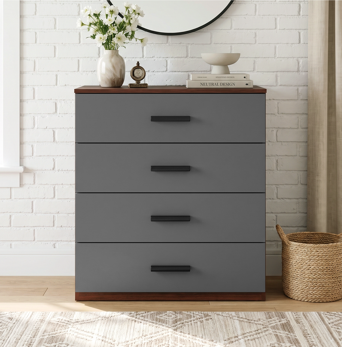 [Walnut] Front view of a modern grey and walnut 4-drawer dresser with black handles styled against a white brick backdrop