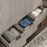 [Grey] wardrobe, lower three drawer unit partially open, displaying storage capacity and folded clothes neatly