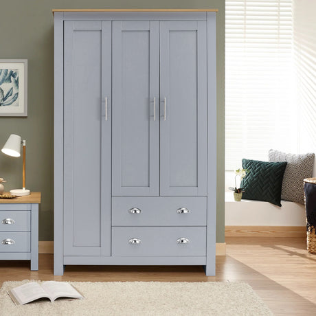 Grey 3-door wardrobe with drawers and bedside table in modern bedroom setting.