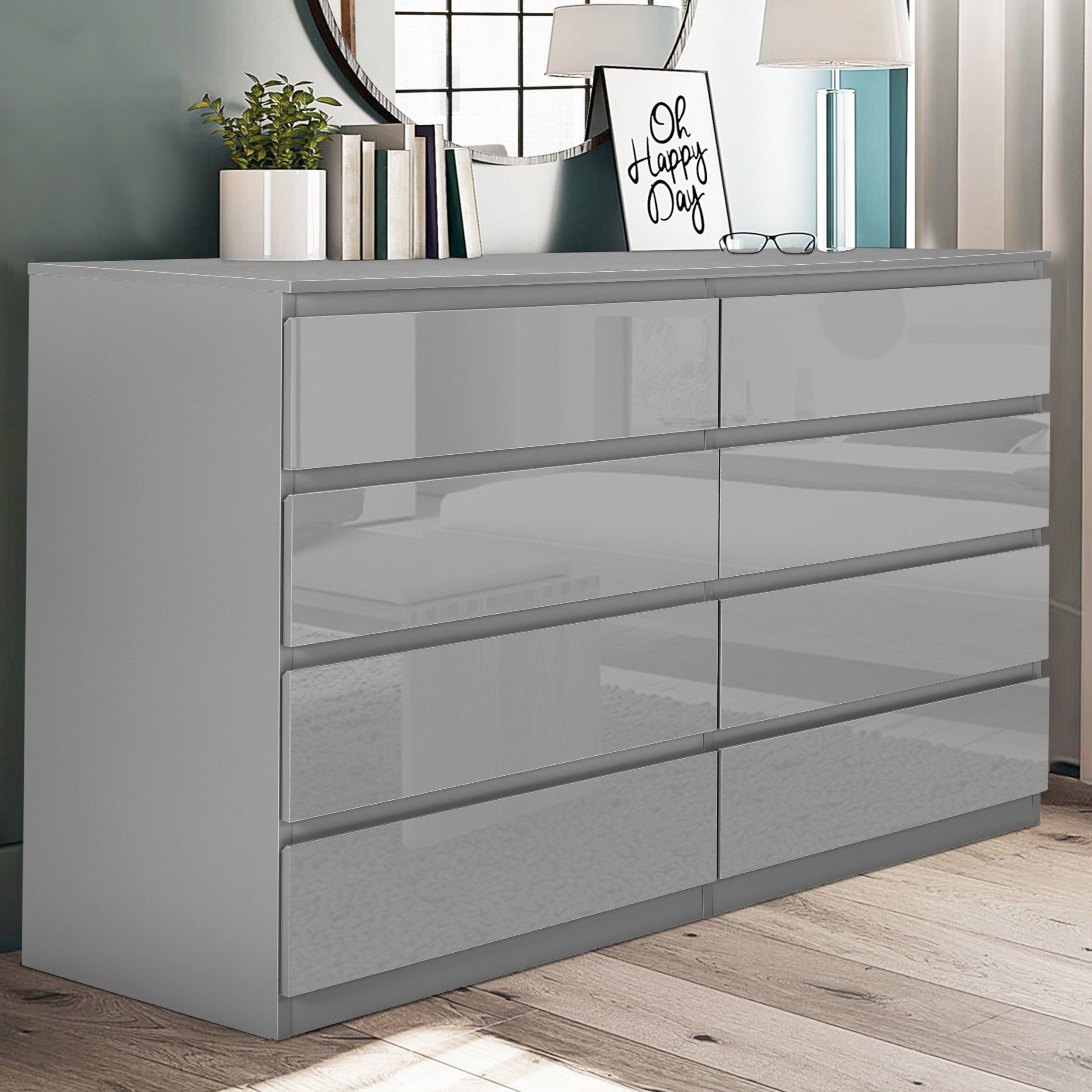 Grey wide chest of drawers with sleek design, perfect for modern bedroom storage.