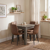 [Grey Wood] Closed flip-top dining table with four brown chairs and tea set in a bright open-plan kitchen diner.
