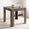 [Grey Wood] Close-up of the closed wood-grain square tabletop, steel hinges and wide legs. Styled with apples, glass and mug
