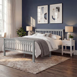 Grey double bed frame in solid wood, positioned centrally with bedding and matching bedside furniture in a bedroom layout