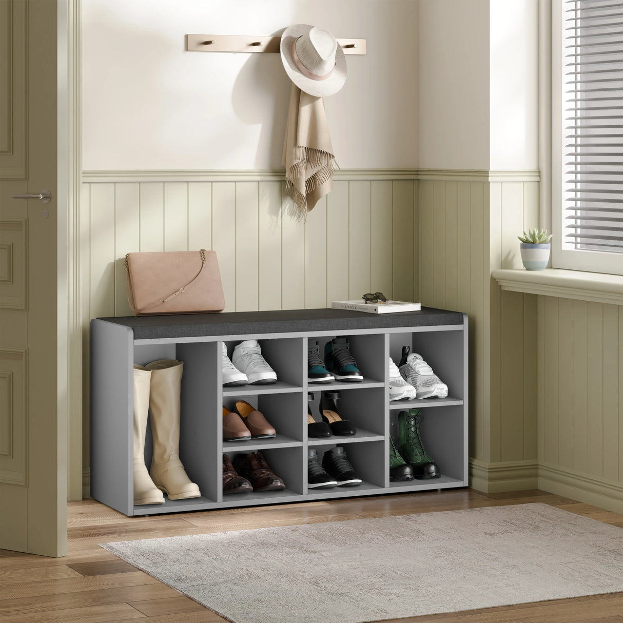 Hallway shoe storage bench with cushion and adjustable shelves in grey, featuring multiple compartments for organized shoe storage in entryway.