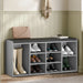 Hallway shoe storage bench with cushion and adjustable shelves in grey, featuring multiple compartments for organized shoe storage in entryway.