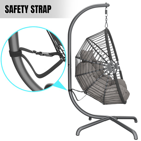 Hanging egg chair with stand, cushion, and safety strap for secure and comfortable seating.