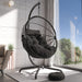 Hanging egg chair with stand, black cushions, and modern design for indoor relaxation.